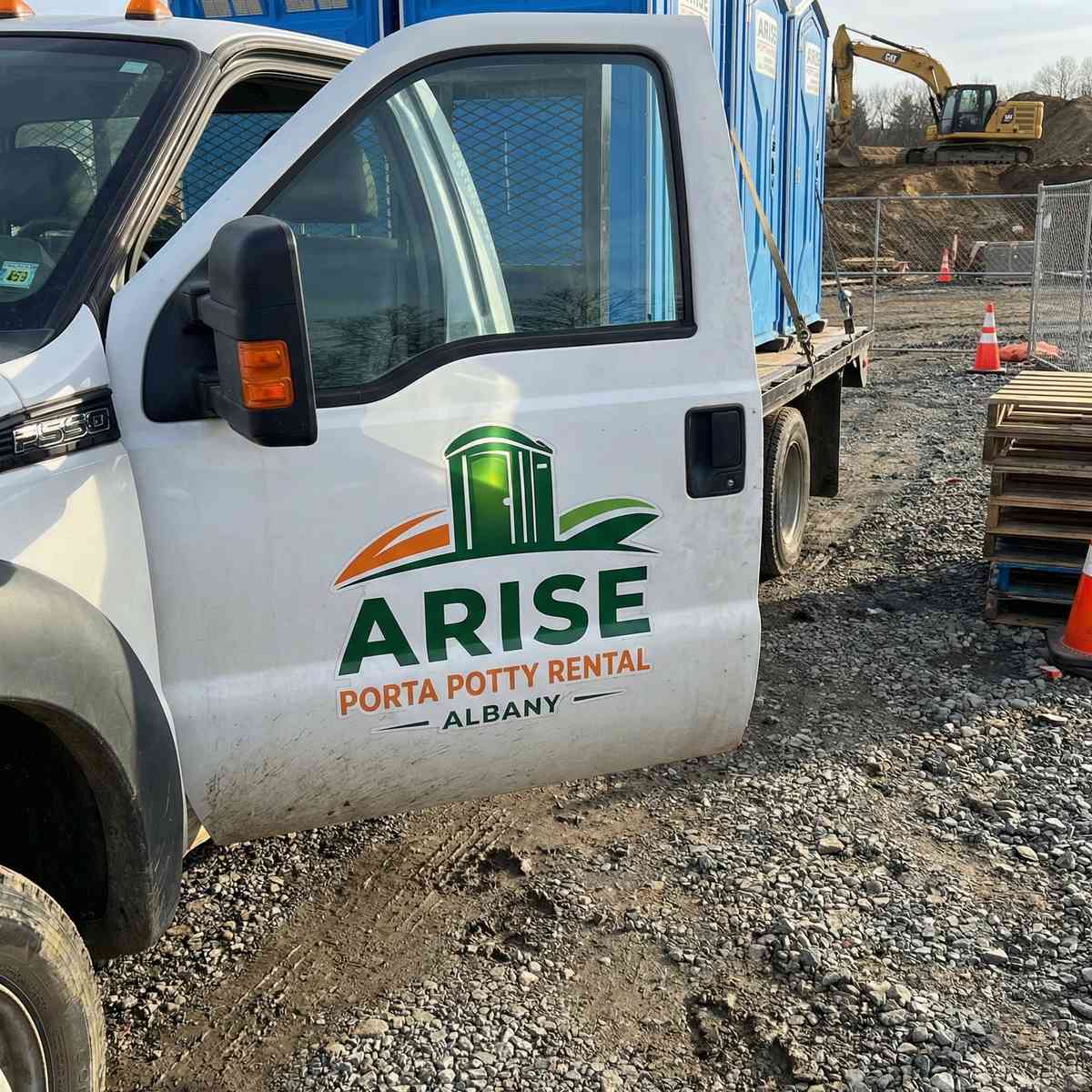 Arise Porta Potty Rental Albany delivery truck at construction site